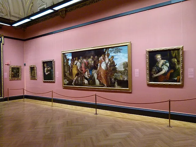 Room 10 of the Picture Gallery, with pink walls and large Venetian paintings