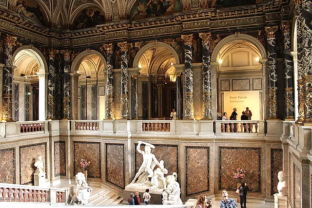 The staircase hall of the Kunsthistorisches Museum with its arcades and marble