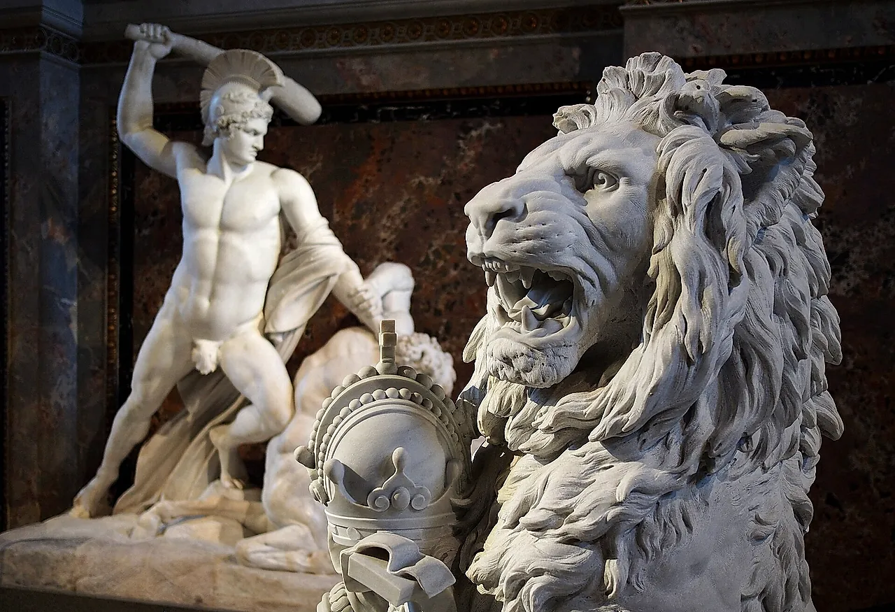 Detail of Canova's Theseus and the Centaur on the staircase of the Kunsthistorisches Museum, with a lion in the foreground